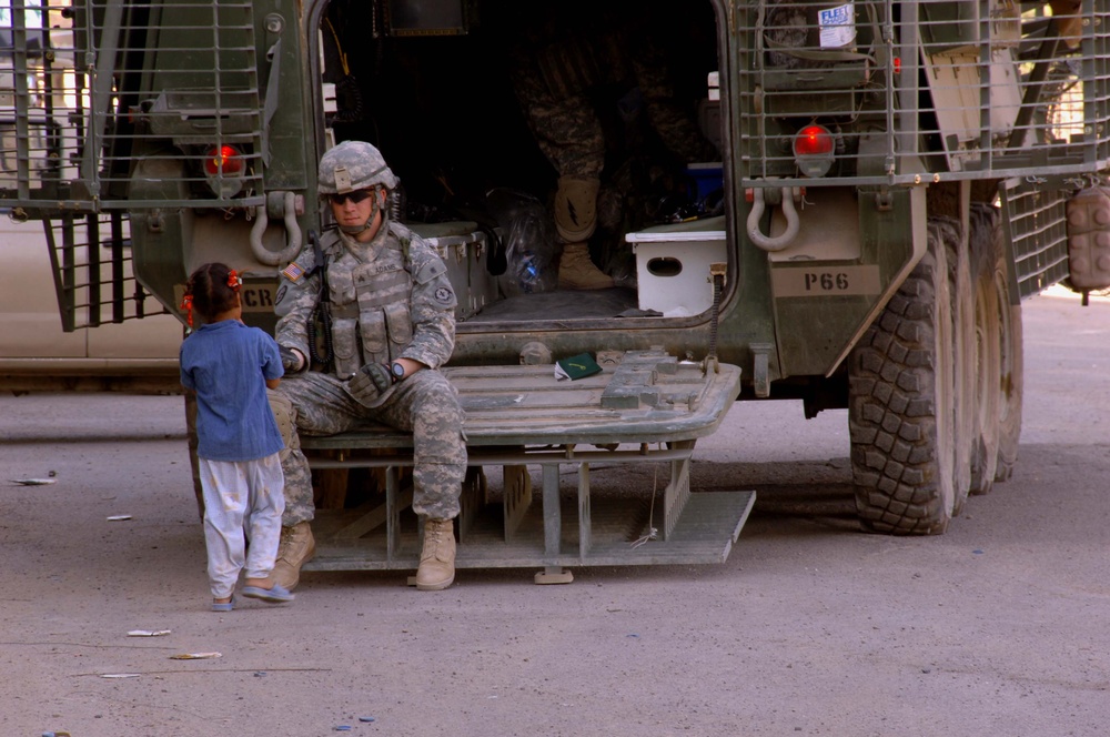 Soldiers Patrol throught the streets of Baghdad