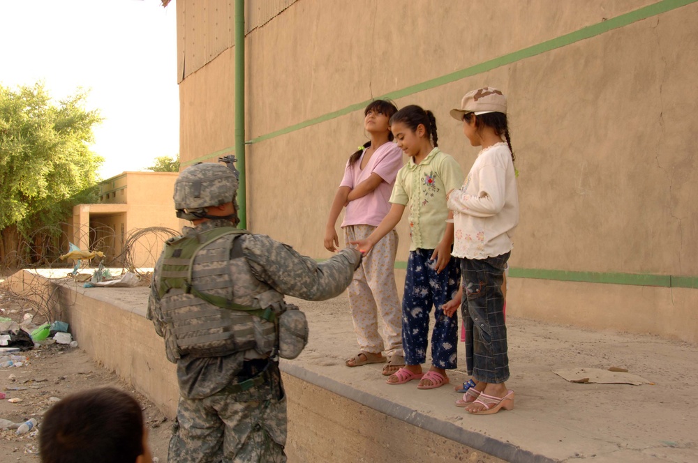 Soldiers Patrol throught the streets of Baghdad