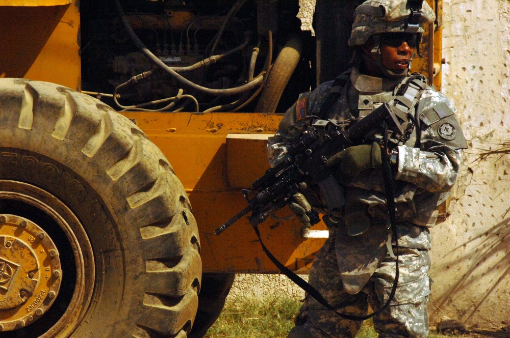 Soldiers Patrol throught the streets of Baghdad