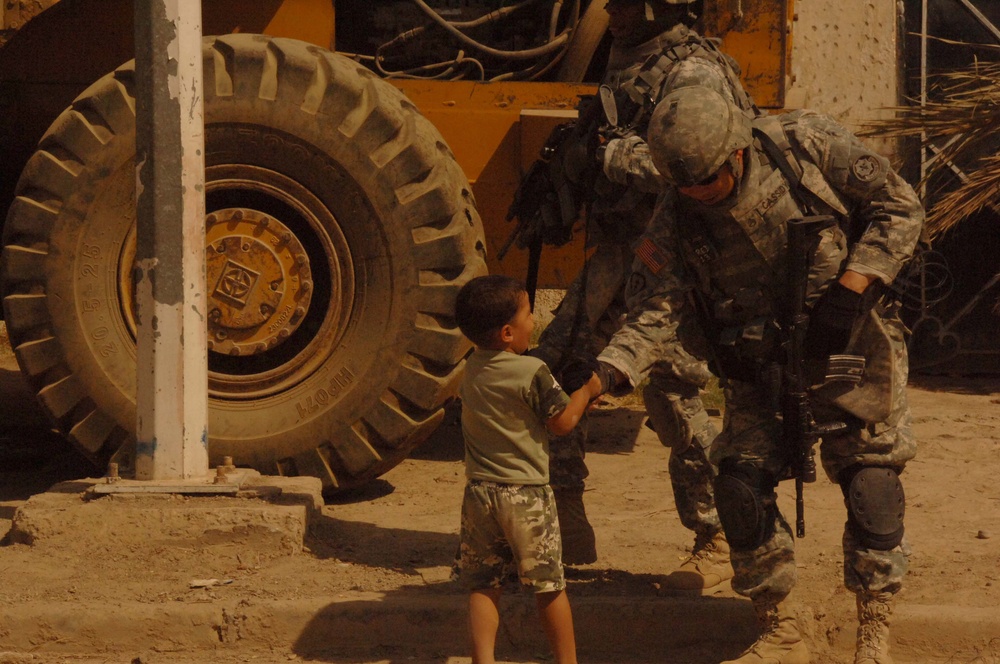 Soldiers Patrol throught the streets of Baghdad