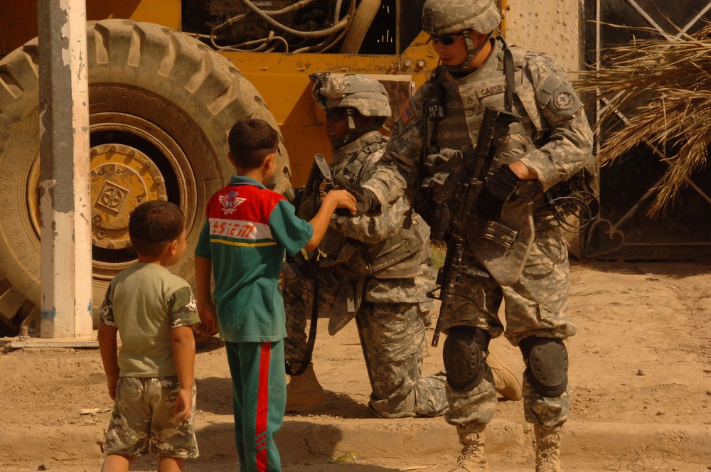 Soldiers Patrol throught the streets of Baghdad