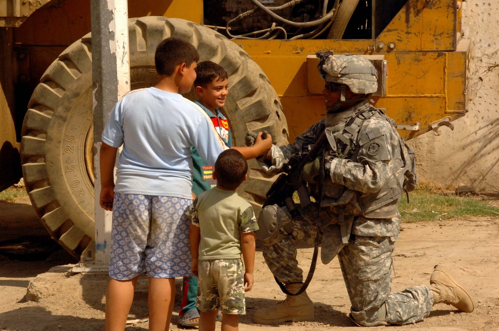 Soldiers Patrol throught the streets of Baghdad