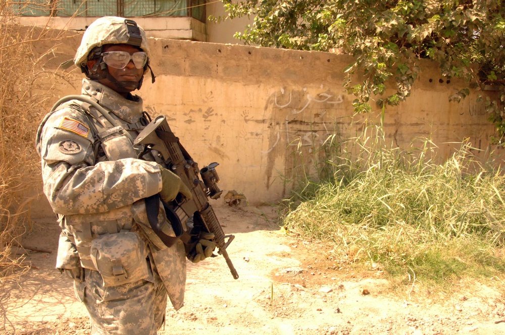 Soldiers Patrol throught the streets of Baghdad