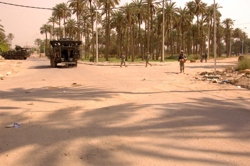 Soldiers Patrol throught the streets of Baghdad
