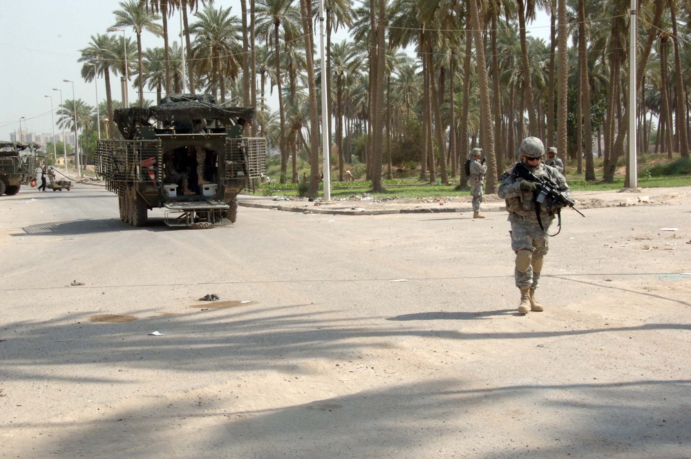 Soldiers Patrol throught the streets of Baghdad