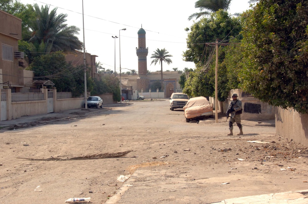 Soldiers Patrol throught the streets of Baghdad