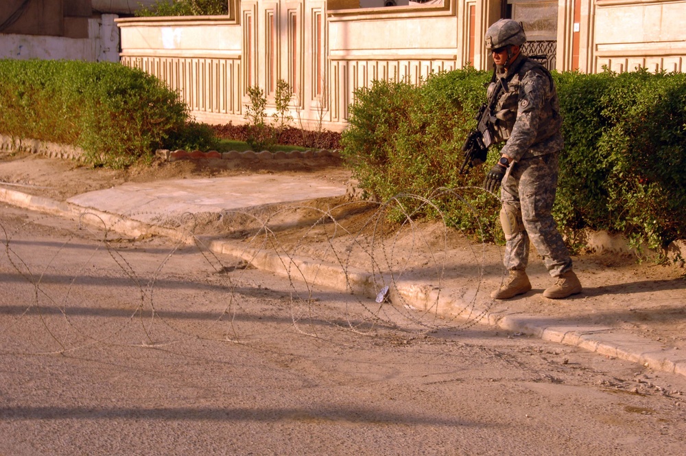Soldiers Patrol throught the streets of Baghdad