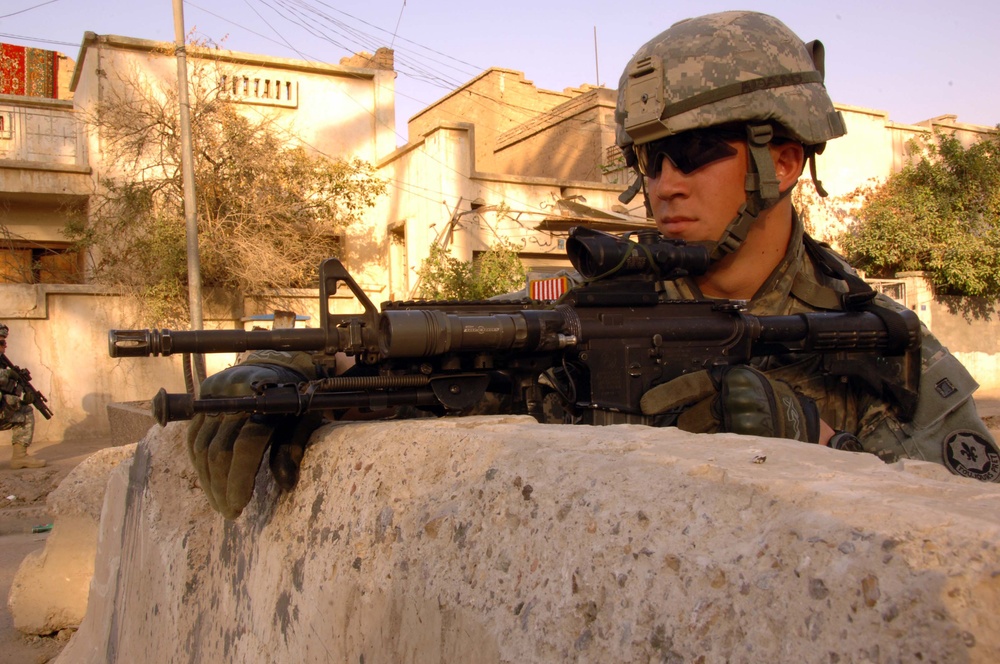 Soldiers Patrol throught the streets of Baghdad