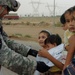 Stryker Troops Deliver School Supplies, Smiles to Iraqi Children
