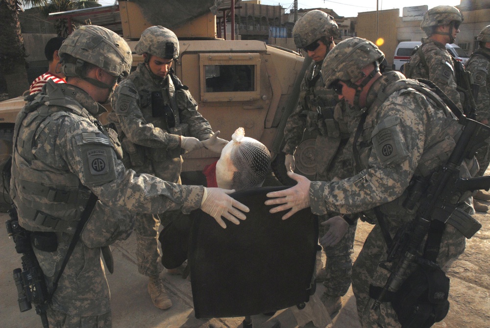 Paratroopers aid volunteers wounded fighting insurgents in eastern Baghdad