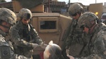 Image 20: Paratroopers aid volunteers wounded fighting insurgents in eastern Baghdad