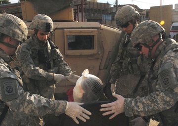 Paratroopers aid volunteers wounded fighting insurgents in eastern Baghdad