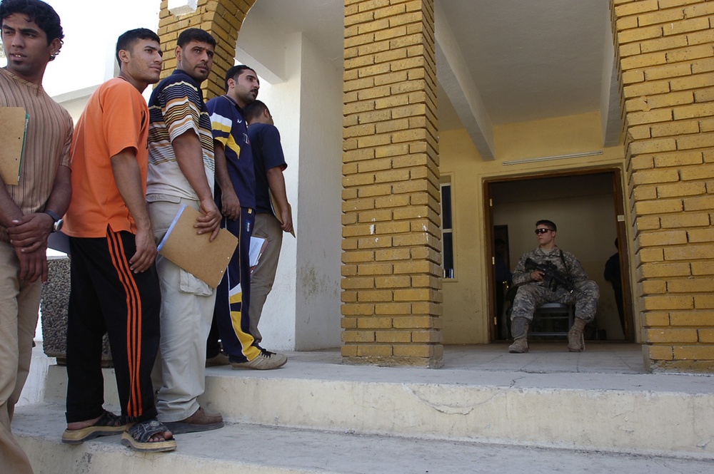 East Baghdad residents line up for police recruitment drive