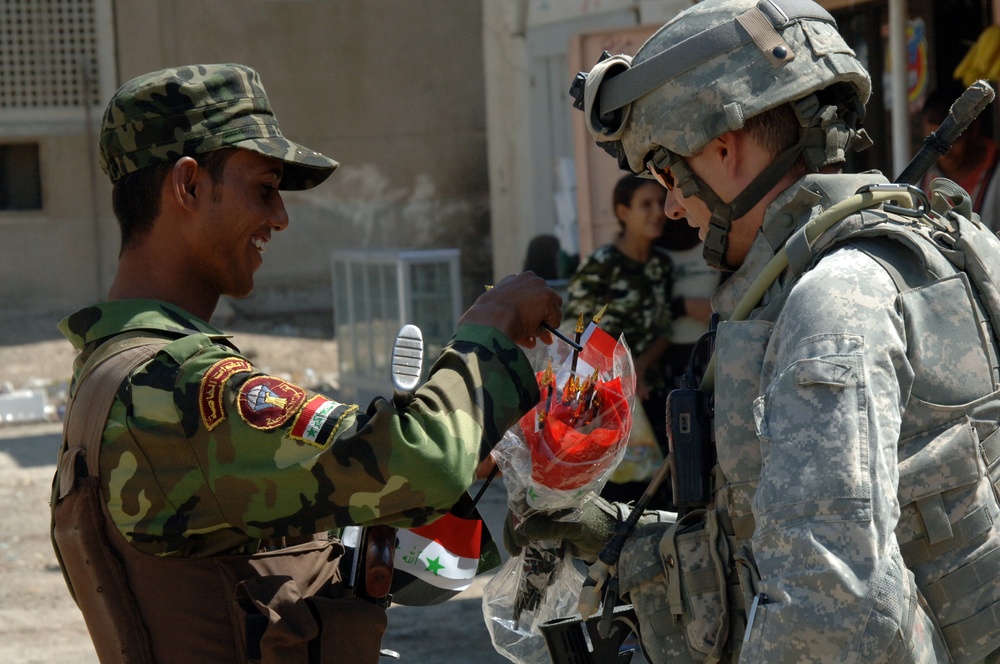 Soldiers at a small mall in Saha, Baghdad