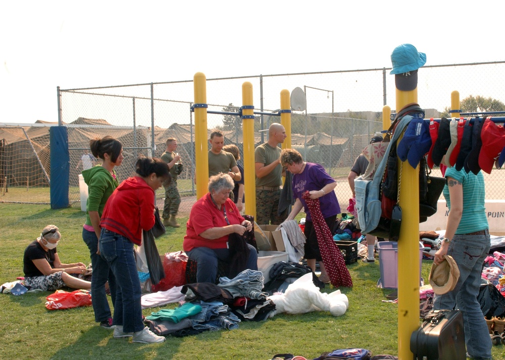 military personnel and their families seek shelter on Naval Base