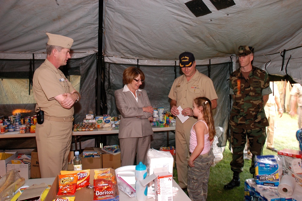 Congresswoman and Admiral Tour Shelter for Military Familes