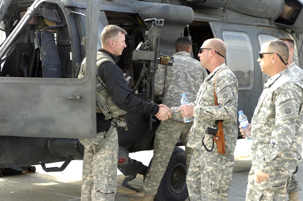 Chief Warrant Officer Jim Myers (left) being congratulated by 82nd Combat A