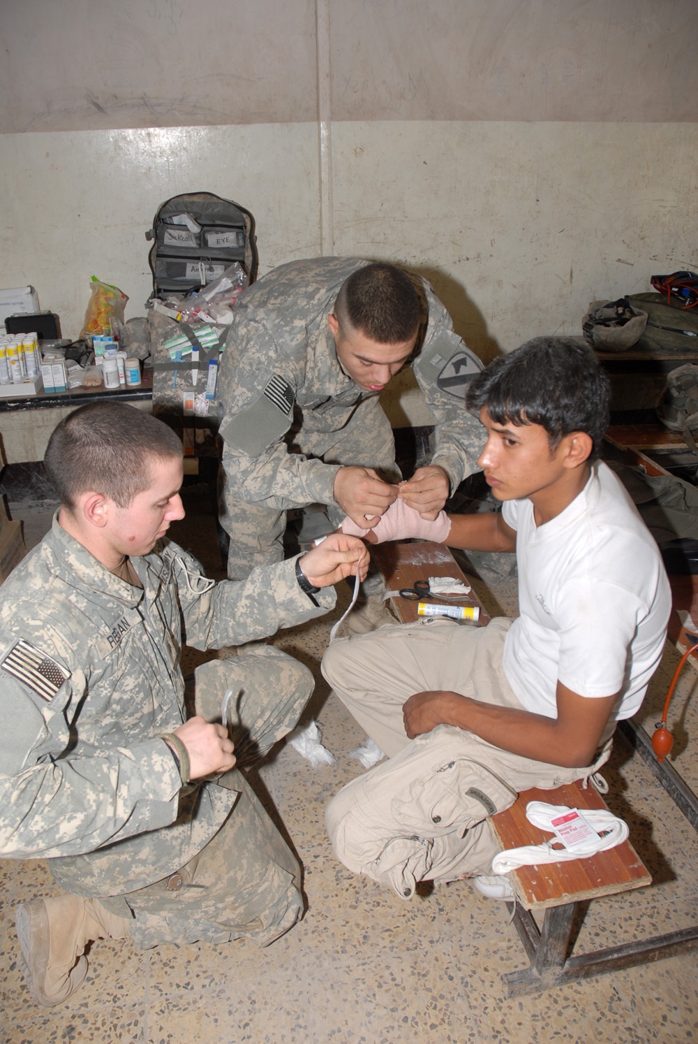 1-8 Cavalry Soldiers help provide medical aid