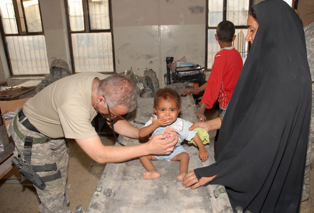 1-8 Cavalry Soldiers help provide medical aid