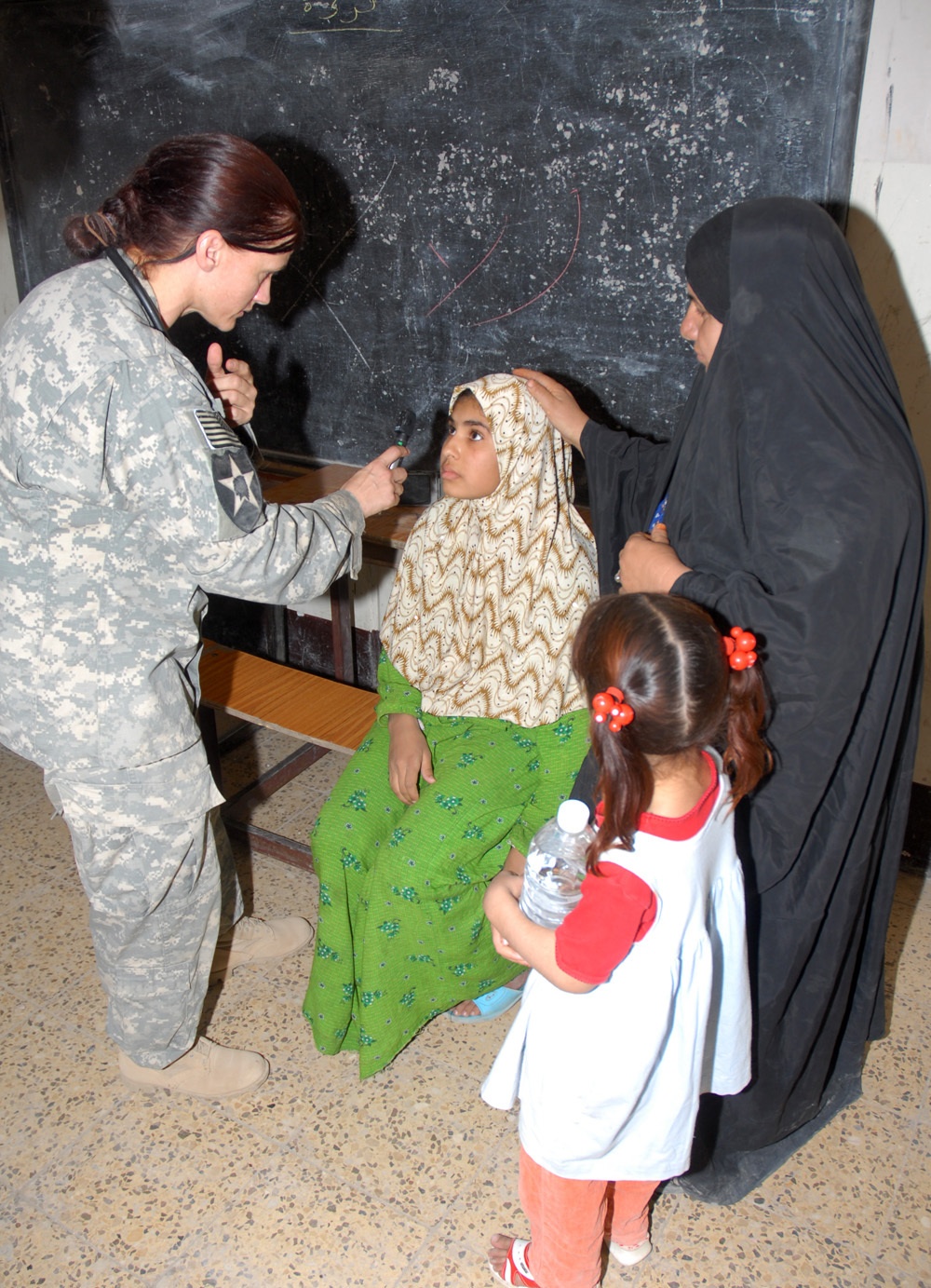 1-8 Cavalry Soldiers help provide medical aid