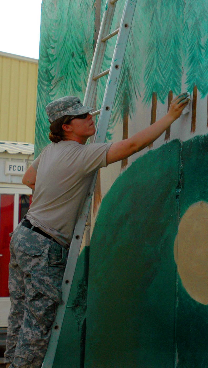 215th BSB soldier mixes paint with selfless service