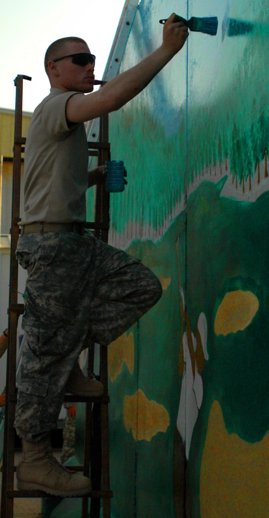 215th BSB soldier mixes paint with selfless service