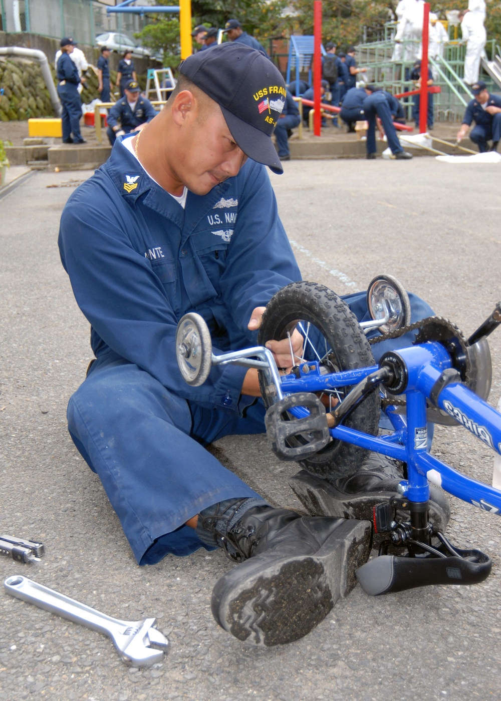 Petty Officer repairs bike