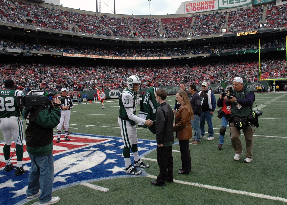 Chad Pennington presents parents of medal of honor recipient