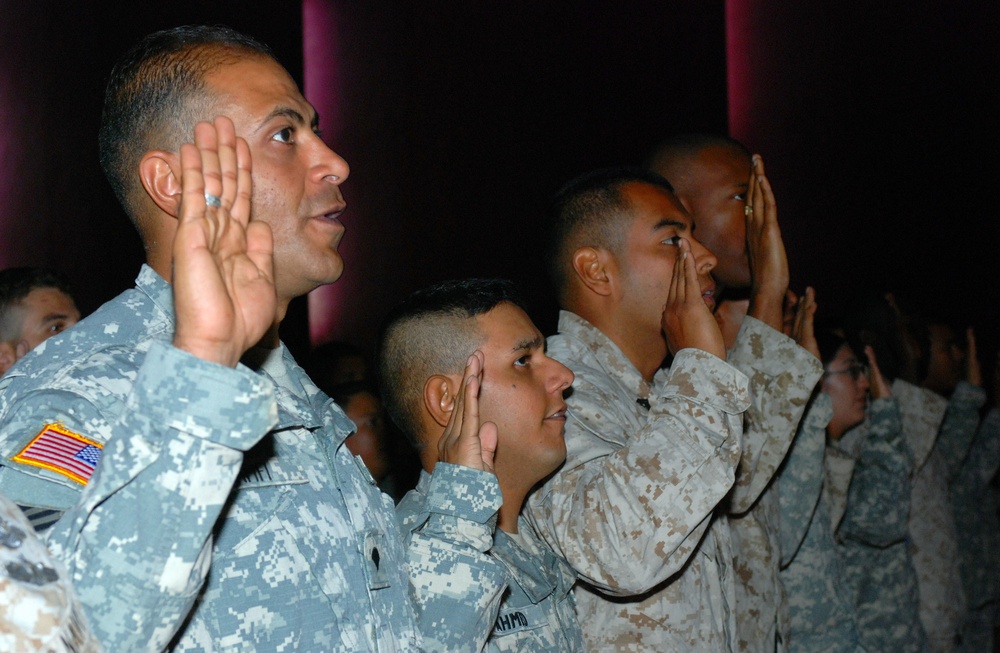 Spc. Yasser Affifi, a linguist with 2nd Brigade Combat Team, 3rd Infantry Division, takes the Oath of Allegiance for naturalized citizens, Nov. 11, at Logistic Support Area Anaconda. Affifi is one of 178 veterans who earned U.S. citizenship on Veterans Da