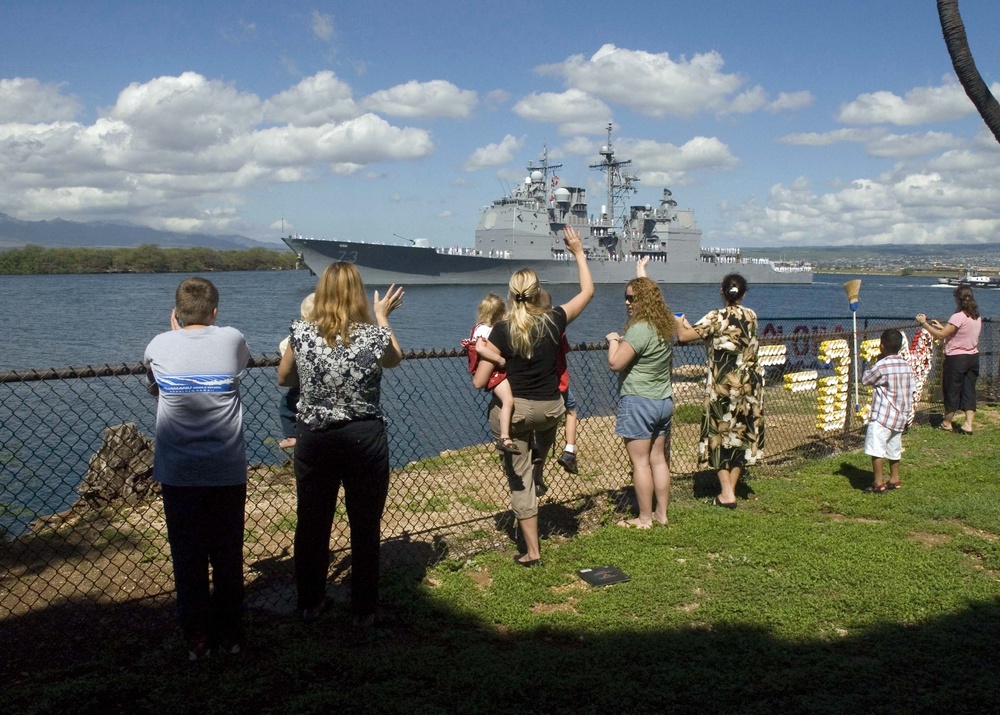 Families waves farewell to Sailors aboard USS Port Royal