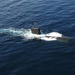 USS Miami submarine surfaces for exercise