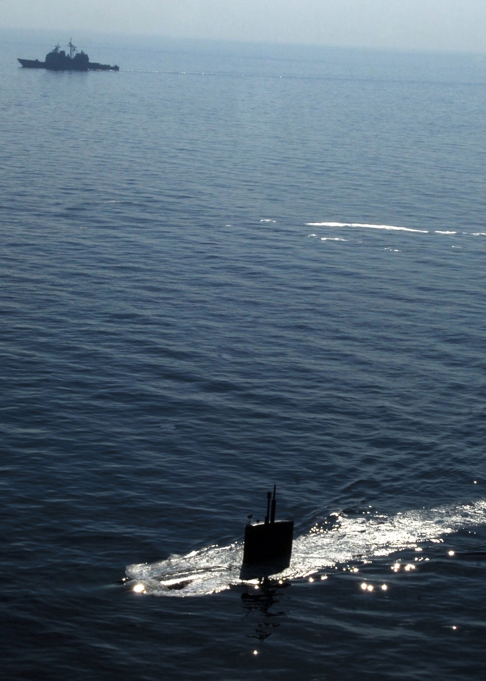 USS Miami submarine surfaces for exercise