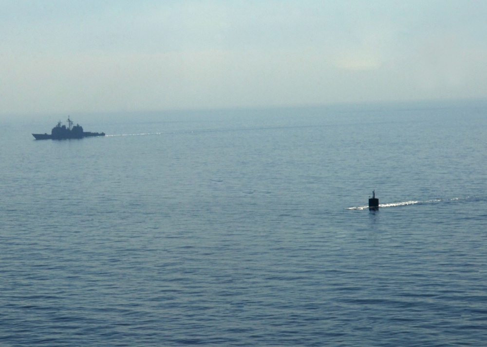 USS Miami submarine surfaces for exercise