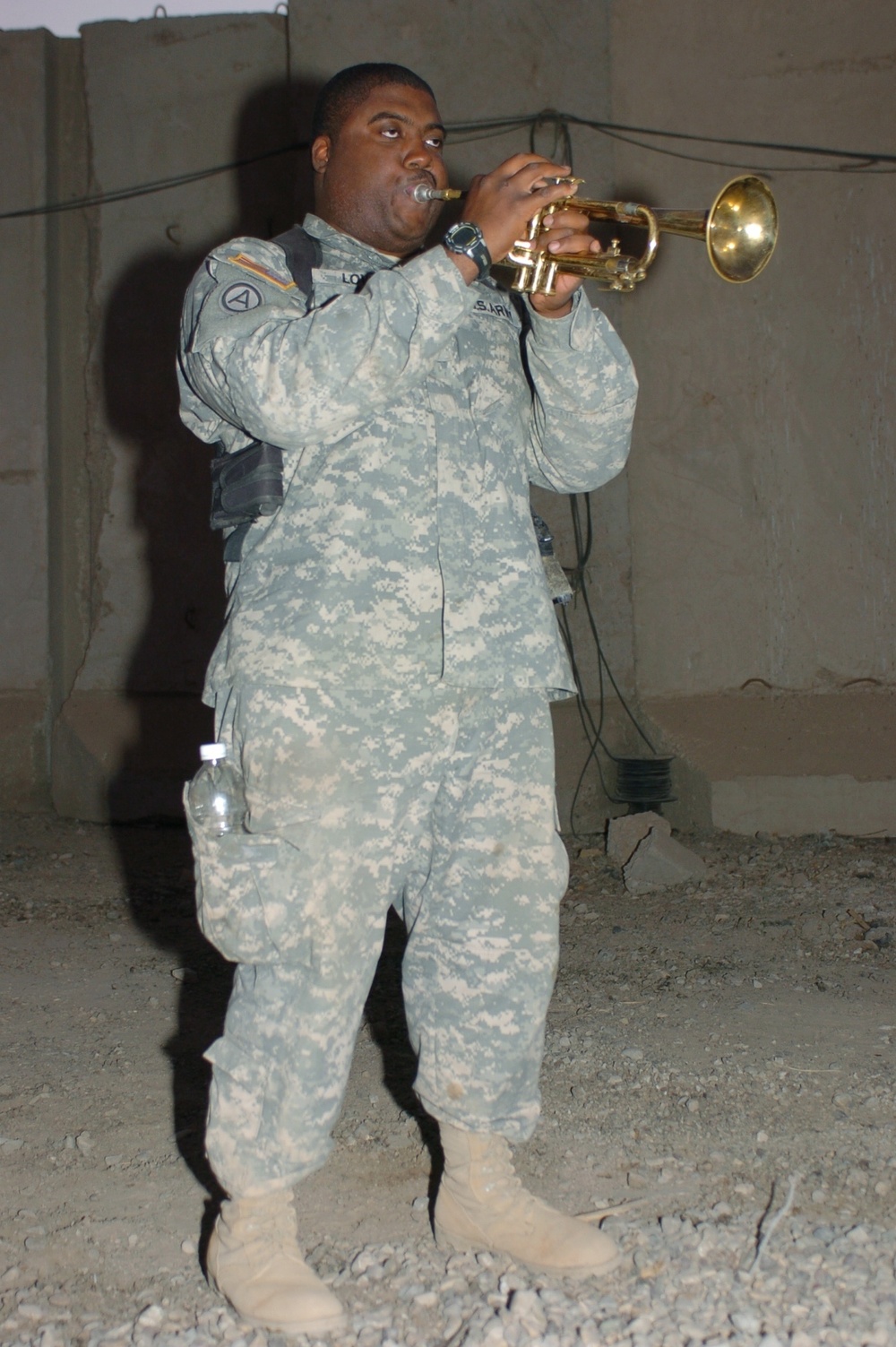 MP plays the trumpet, cheers fellow Soldiers