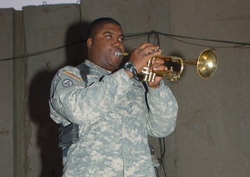 MP plays the trumpet, cheers fellow Soldiers