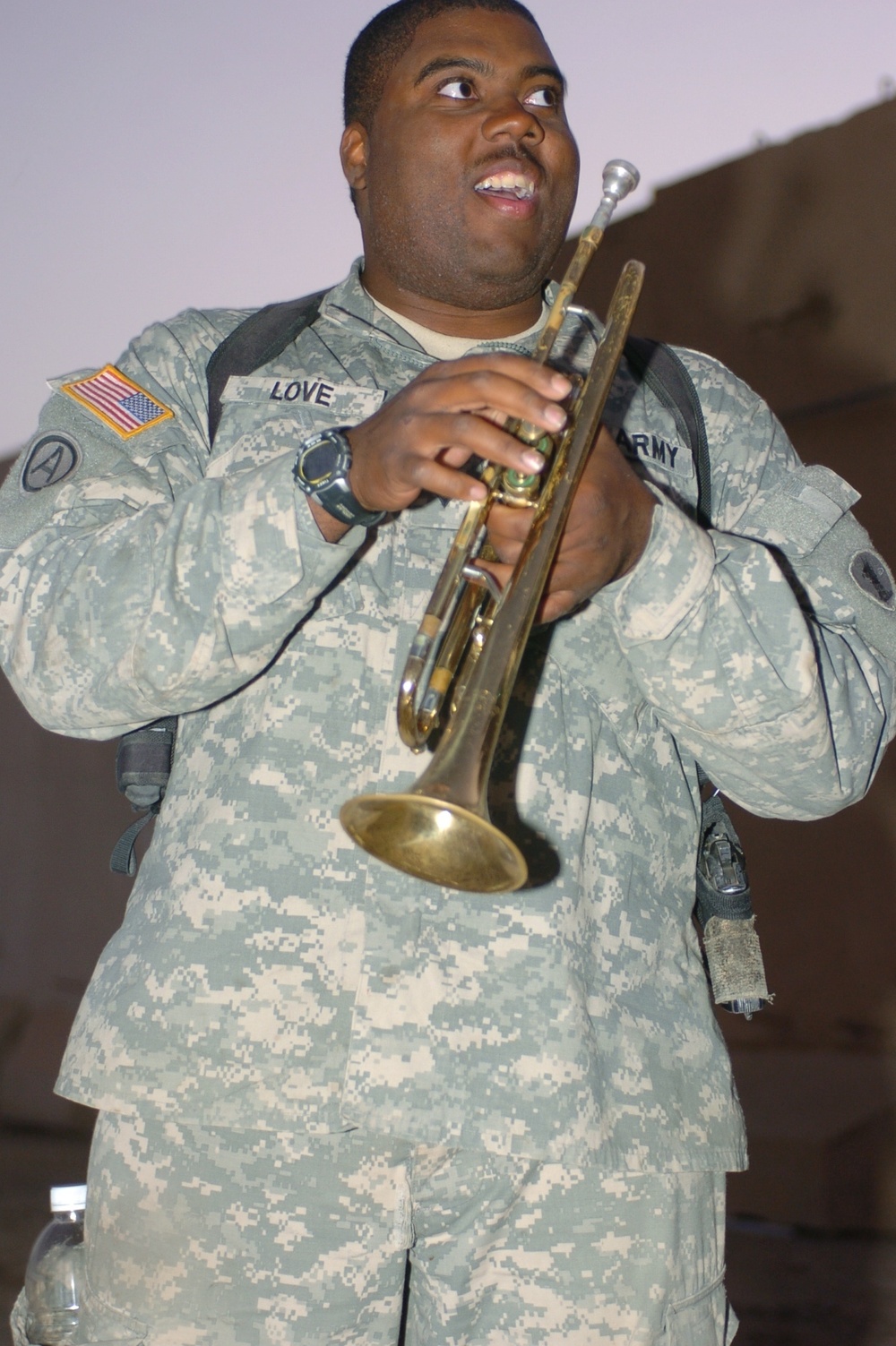 MP plays the trumpet, cheers fellow Soldiers