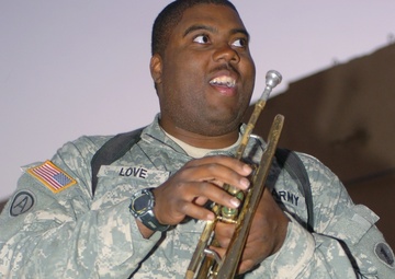 MP plays the trumpet, cheers fellow Soldiers