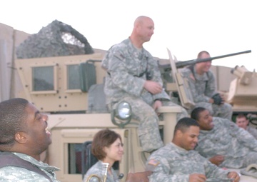 MP plays the trumpet, cheers fellow Soldiers