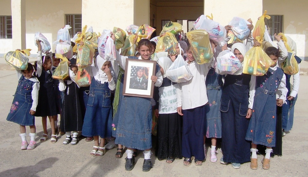 Fallen Paratrooper's family gives school supplies to Iraqi girls