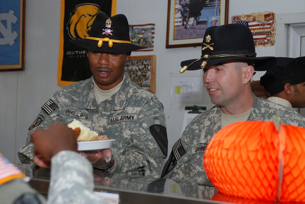 Soldiers gather together with &quot;second family&quot; for holiday meal