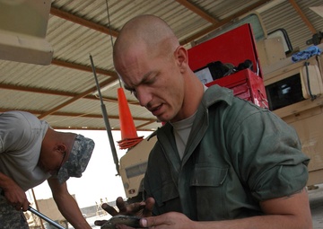 'Like a Pit Crew,' Mechanics Keep Batteries Firing