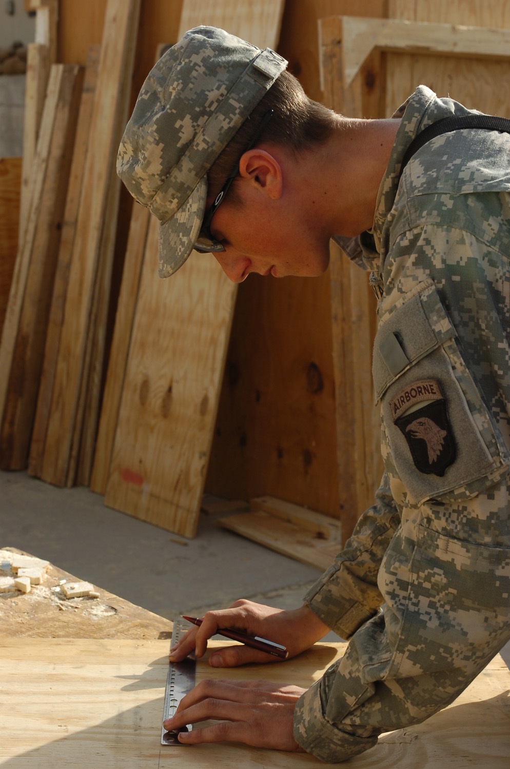 Soldiers building beds