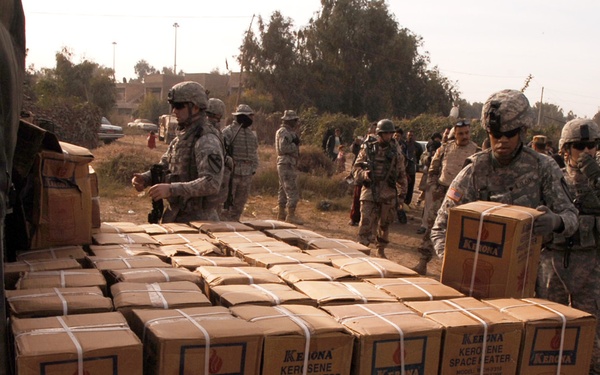 With colder weather on the way, troops distribute heaters in central Baghda