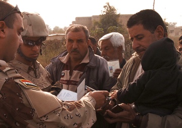 With colder weather on the way, troops distribute heaters in central Baghda