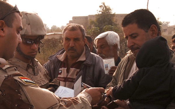 With colder weather on the way, troops distribute heaters in central Baghda