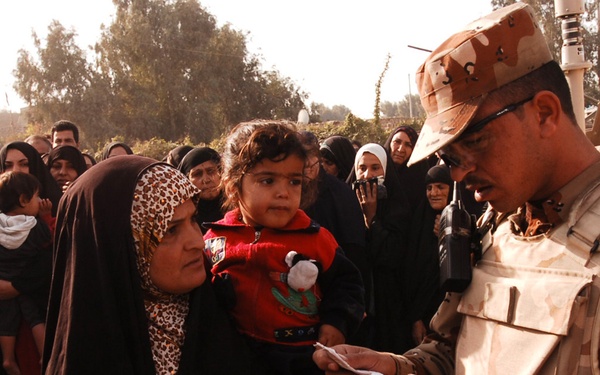 With colder weather on the way, troops distribute heaters in central Baghda