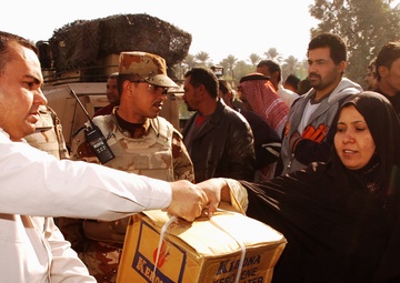 With colder weather on the way, troops distribute heaters in central Baghda