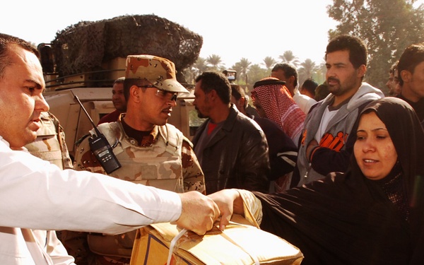 With colder weather on the way, troops distribute heaters in central Baghda