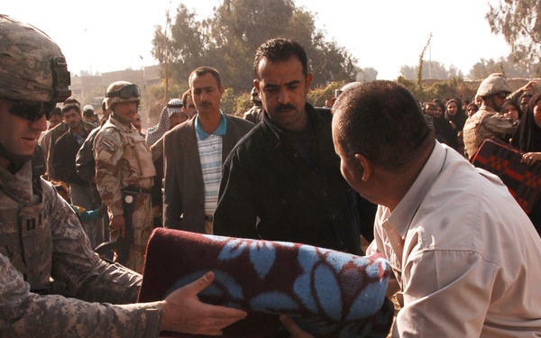 With colder weather on the way, troops distribute heaters in central Baghda