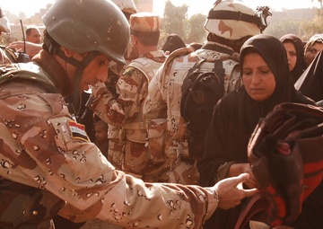 With colder weather on the way, troops distribute heaters in central Baghda